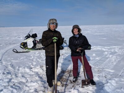 Researchers Yaoming Li (left) and Neslihan Taş (right) get ready for permafrost sampling as part of a Berkeley Lab team. [Image courtesy of Neslihan Taş.]