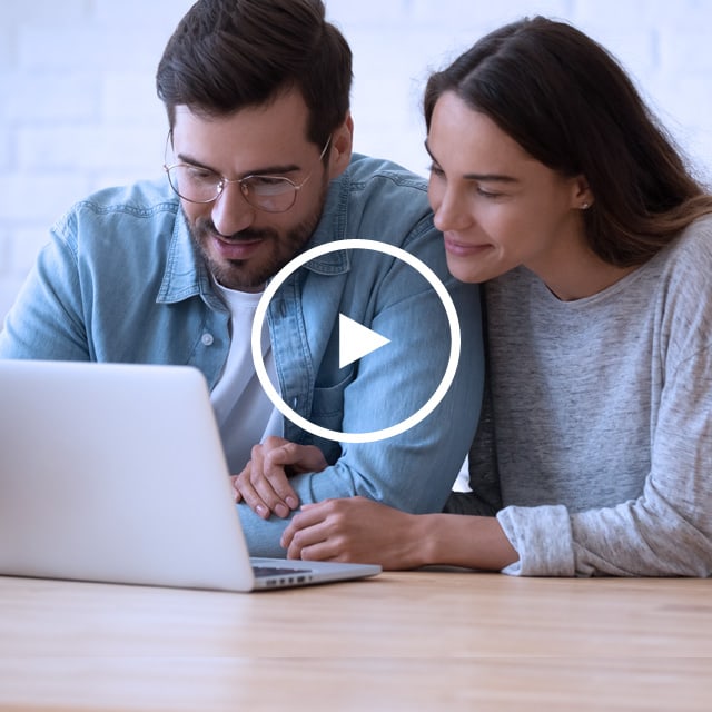 Image of a couple looking at a computer screen.