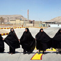 Iranian women form a human chain at the Isfahan Uranium Conversion Facility in support of Iran's nuclear program, outside the city of Isfahan, south of the capital Tehran, Aug. 16, 2005, (AP/Vahid Salemi)