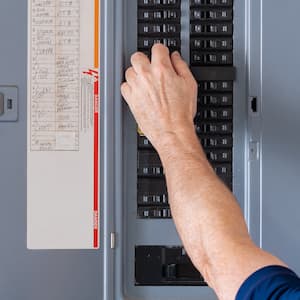 hand adjusting circuit breaker in home