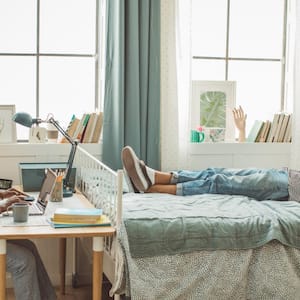 Friends at college dorm room