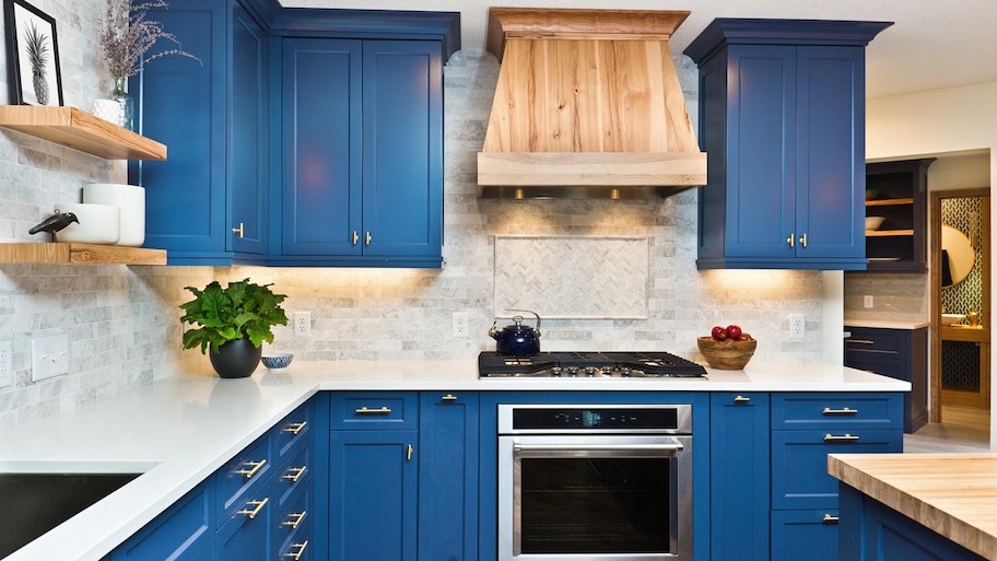 A traditional kitchen with blue cabinets