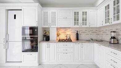 A modern white wooden kitchen interior