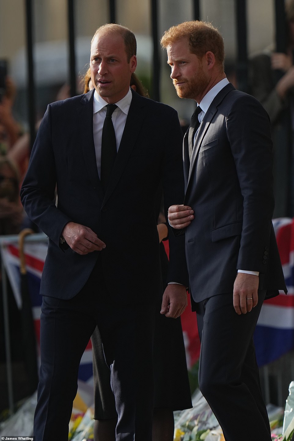 King Charles III's sons Harry and William inspecting floral tributes at Windsor Castle yesterday evening