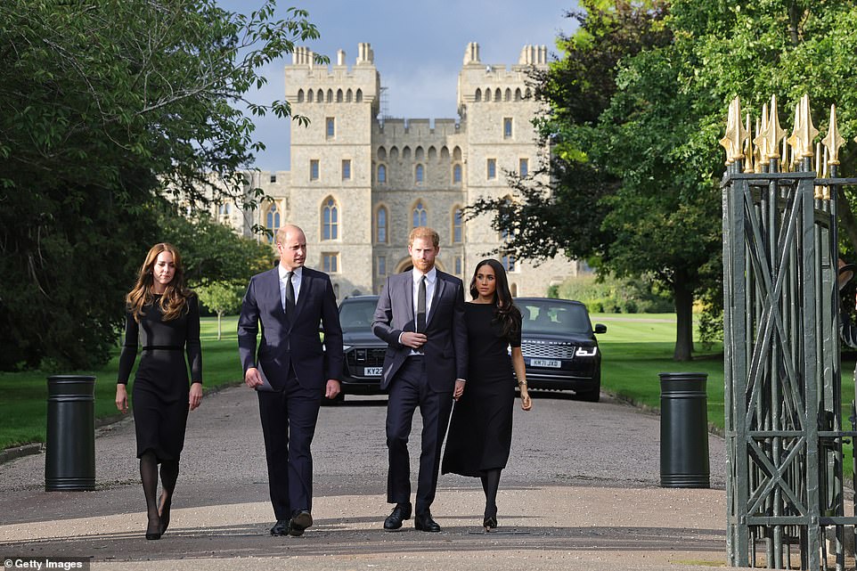 The two couples - previously known as the 'fab four', walked side by side before breaking off to look at floral tributes