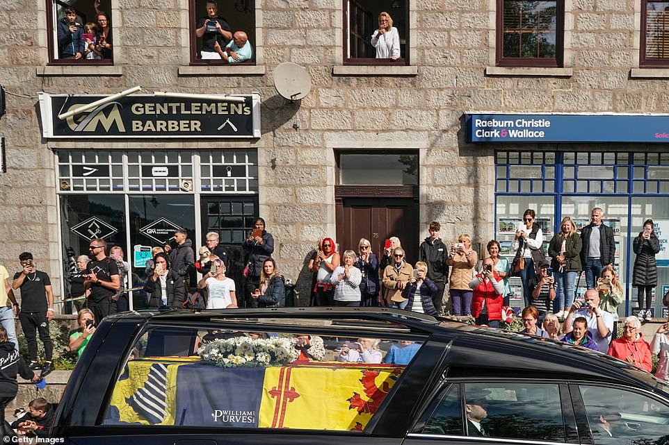 People in Banchory gather to pay their respects as the Queen's coffin makes its way to Edinburgh today