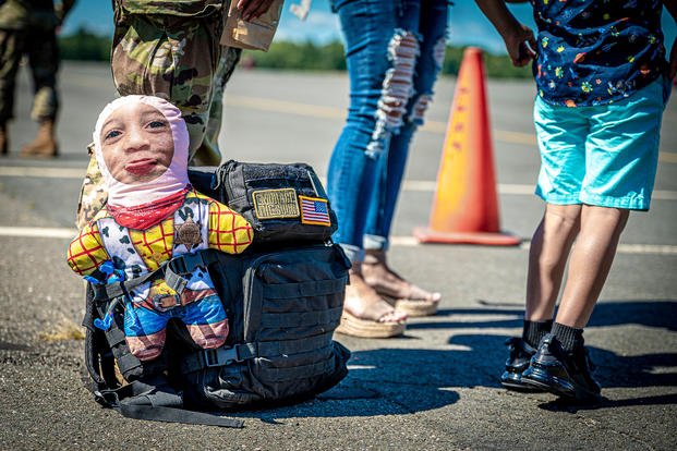 This Week's Top Military Photos: Missile Launch, Dogs Go to the Park, Kid Tries to Fly Helicopter (Kinda)