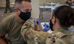 Maj. Eric Korpi, a human resource officer with Joint Task Force Headquarters, Hawaii National Guard Joint Task Force received the Pfizer-BioNTech vaccine on October 1, 2021, at the Hawaii Army Readiness Center, Kalaeloa, Hawaii.