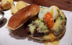 Close-up of a hamburger with egg and melted cheese