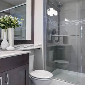 A bright new bathroom interior with glass walk in shower