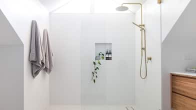 A modern elegant bathroom with a minimal shower