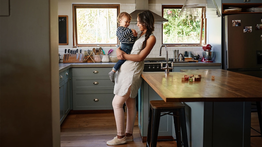 A view of a mother and son in a kitchen