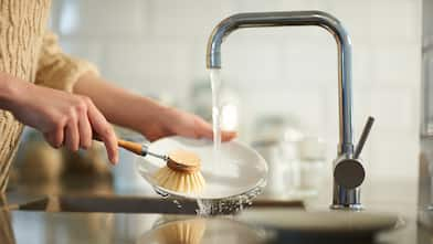 Washing up in kitchen sink