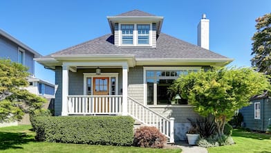 Gray house on green lawn