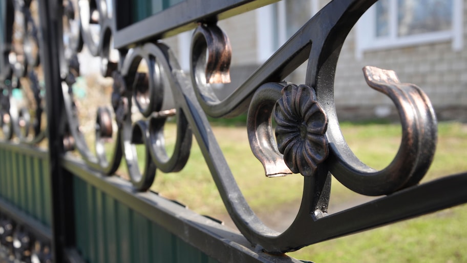 Ornamental metal fence in yard