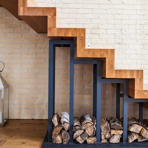 Wood cutout stairs white brick wall firewood