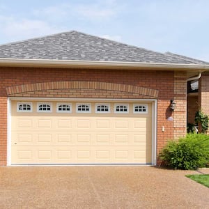 Brick house with yellow garage door