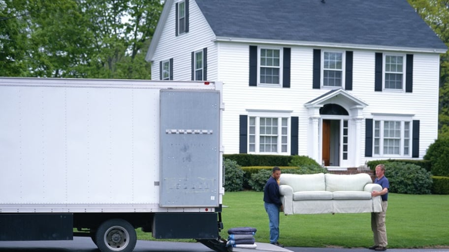 Movers loading furniture in truck