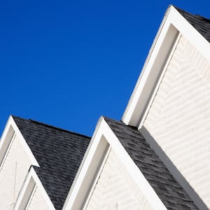 Gray roof on white house