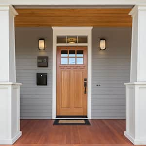 Front porch of home with stained door