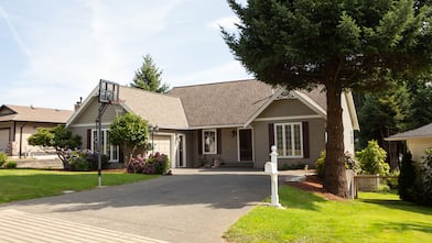 Suburban house with basketball hoop in driveway 