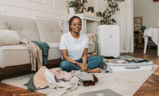 woman sitting on the floor with laundry