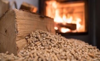 Wood stove heating with in foreground wood pellets - economical heating system concept