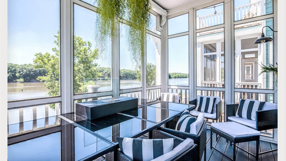 sunroom with black and white furniture 