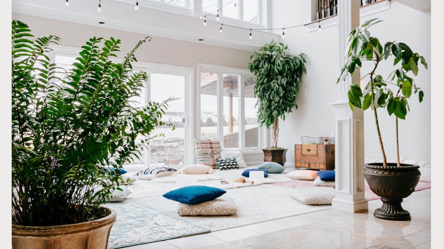 yoga and meditation space set up in sunroom