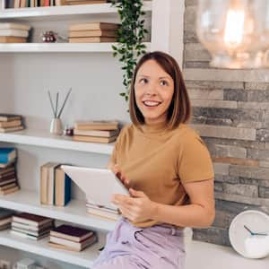 Woman adjusting a smart house system