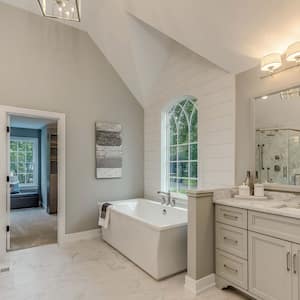 A master bathroom with track lighting