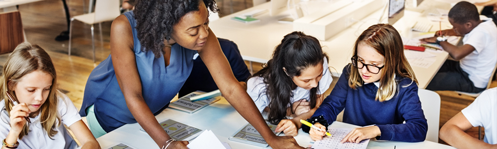 A teacher working with a group of students