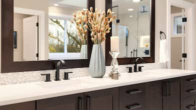 bathroom vanity with brown cabinets