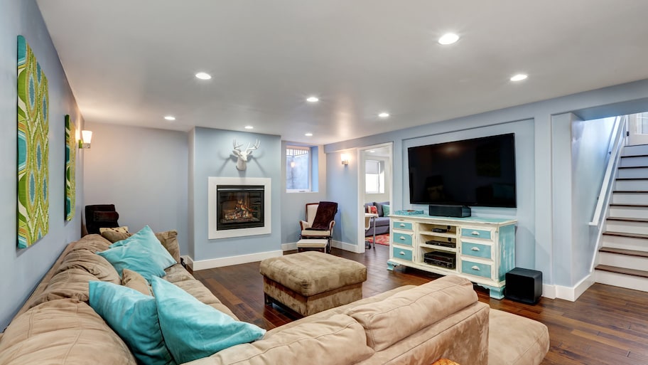 Pastel blue walls in a basement living room