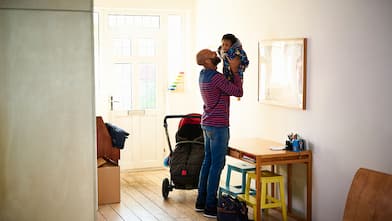 A father and child in a foyer