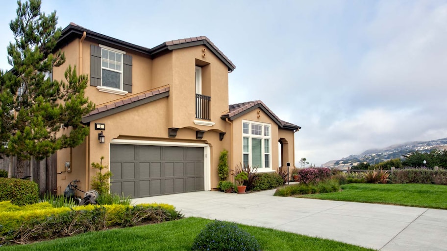 A garage with a concrete driveway