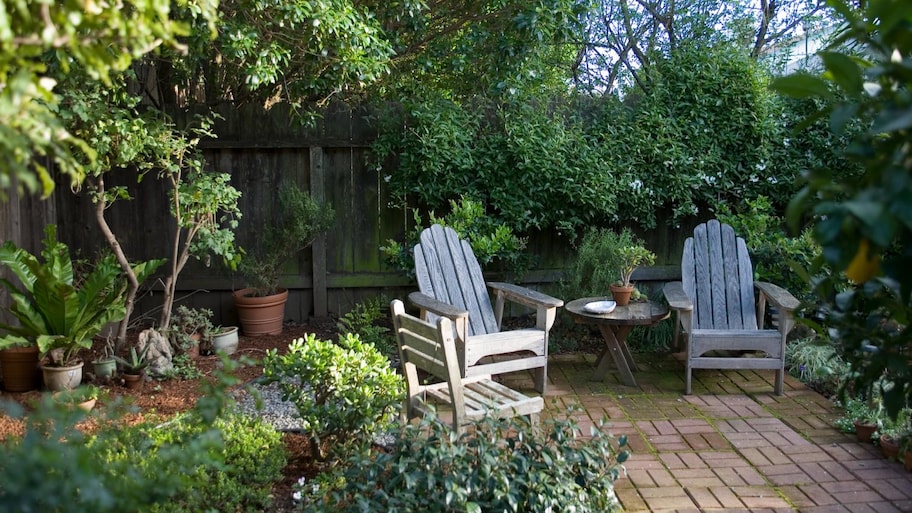 Two deck chairs on brick patio