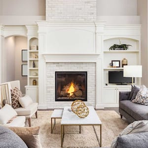 Open concept house with white brick fireplace 