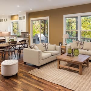 Living room interior with hardwood floors and view of kitchen