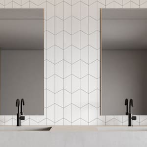 A modern white tile bathroom with a double sink