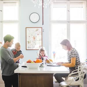 A family spending quality time in their bright kitchen