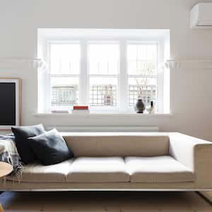 living room with air conditioner on wall