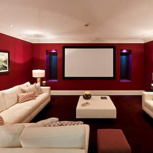 A beautiful cinema room with a huge sofa