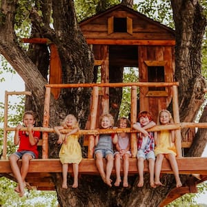 Kids spending their time on a treehouse