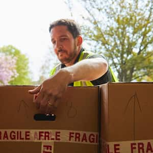 A man in van with boxes