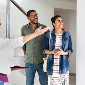 A real estate agent showing apartment to a couple