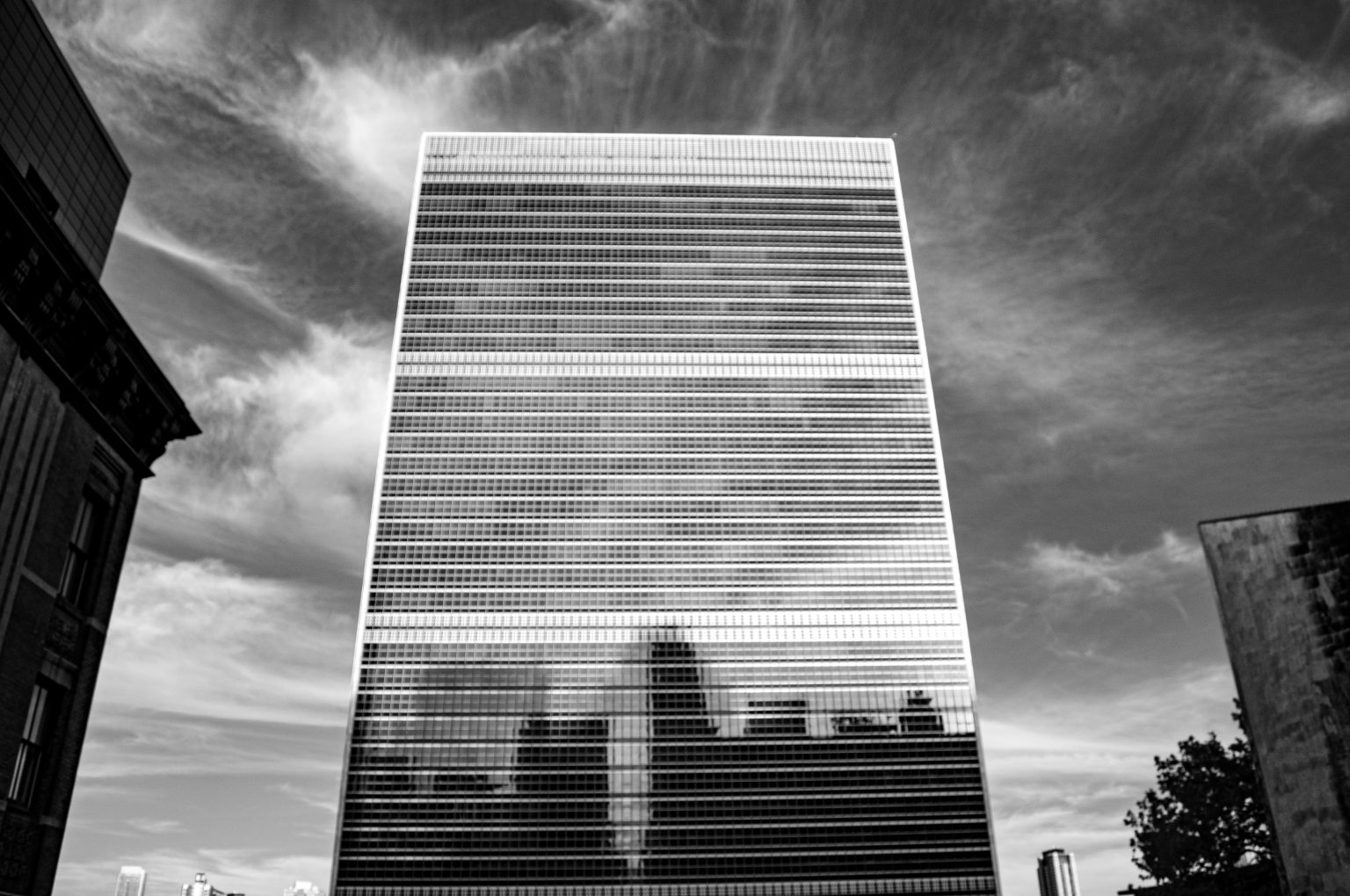 Skyline of New York City, USA, reflected in the United Nations building. Black and white photography contributed by Aaron Jorbin to the WordPress Photo Directory.