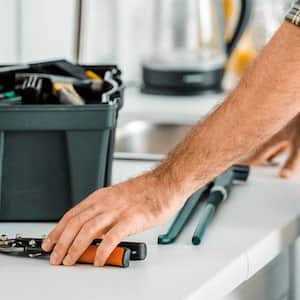 handyman with tools on counter