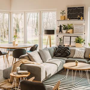 A bright beautiful living room with large windows