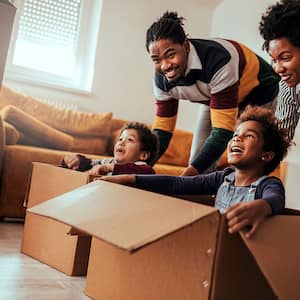 Family playing with moving boxes